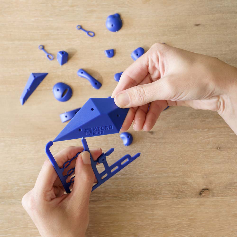 Hands detaching blue micro send pieces