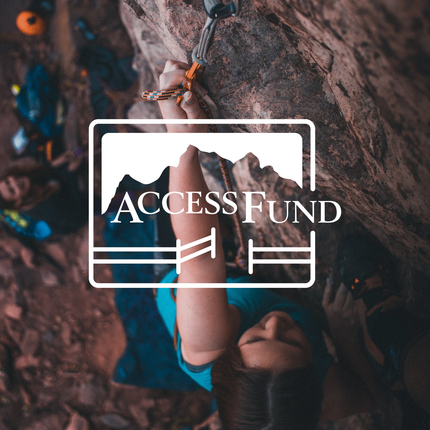 Woman climbing with Access Fund Logo